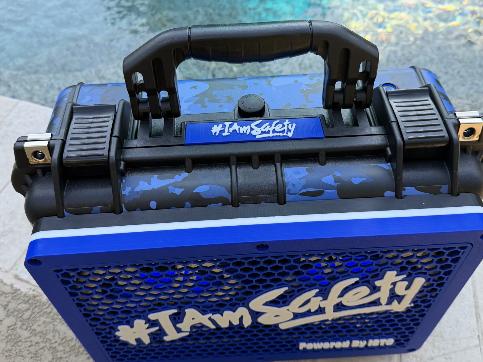 Top of the #IAmSafety boom box showing handle and badge